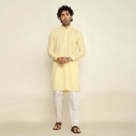 NAQSH Light Yellow Chikankari Kurta for Men which has chikankari embroidery. Perfect mens light yellow wedding kurta for male by Crease India.