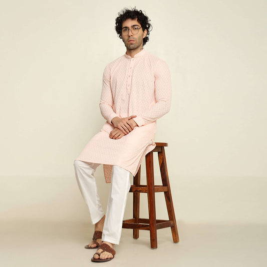 NAQSH Pastel Pink Chikankari Kurta for Men which has chikankari embroidery. Perfect mens pink wedding kurta for male by Crease India.