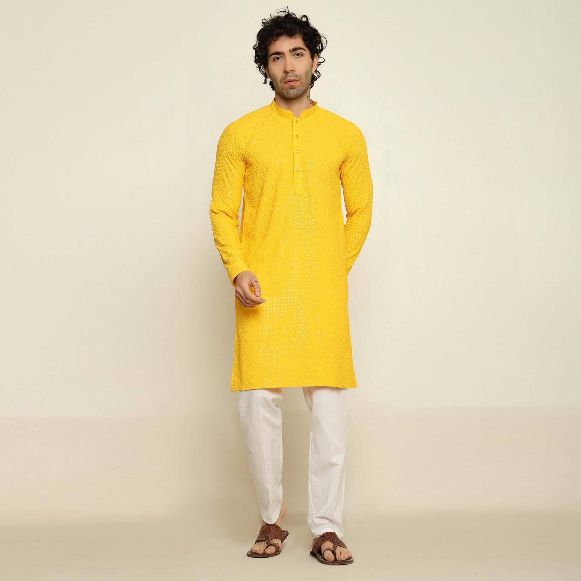 NAQSH Yellow Sequin Embellished Chikankari Kurta for Men which has chikankari and sequins embellishments. Perfect mens haldi wedding kurta for male by Crease India.