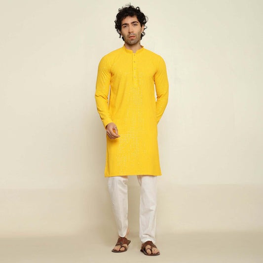 NAQSH Yellow Sequin Embellished Chikankari Kurta for Men which has chikankari and sequins embellishments. Perfect mens haldi wedding kurta for male by Crease India.