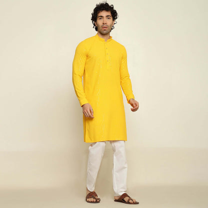 NAQSH Yellow Sequin Embellished Chikankari Kurta for Men which has chikankari and sequins embellishments. Perfect mens haldi wedding kurta for male by Crease India.