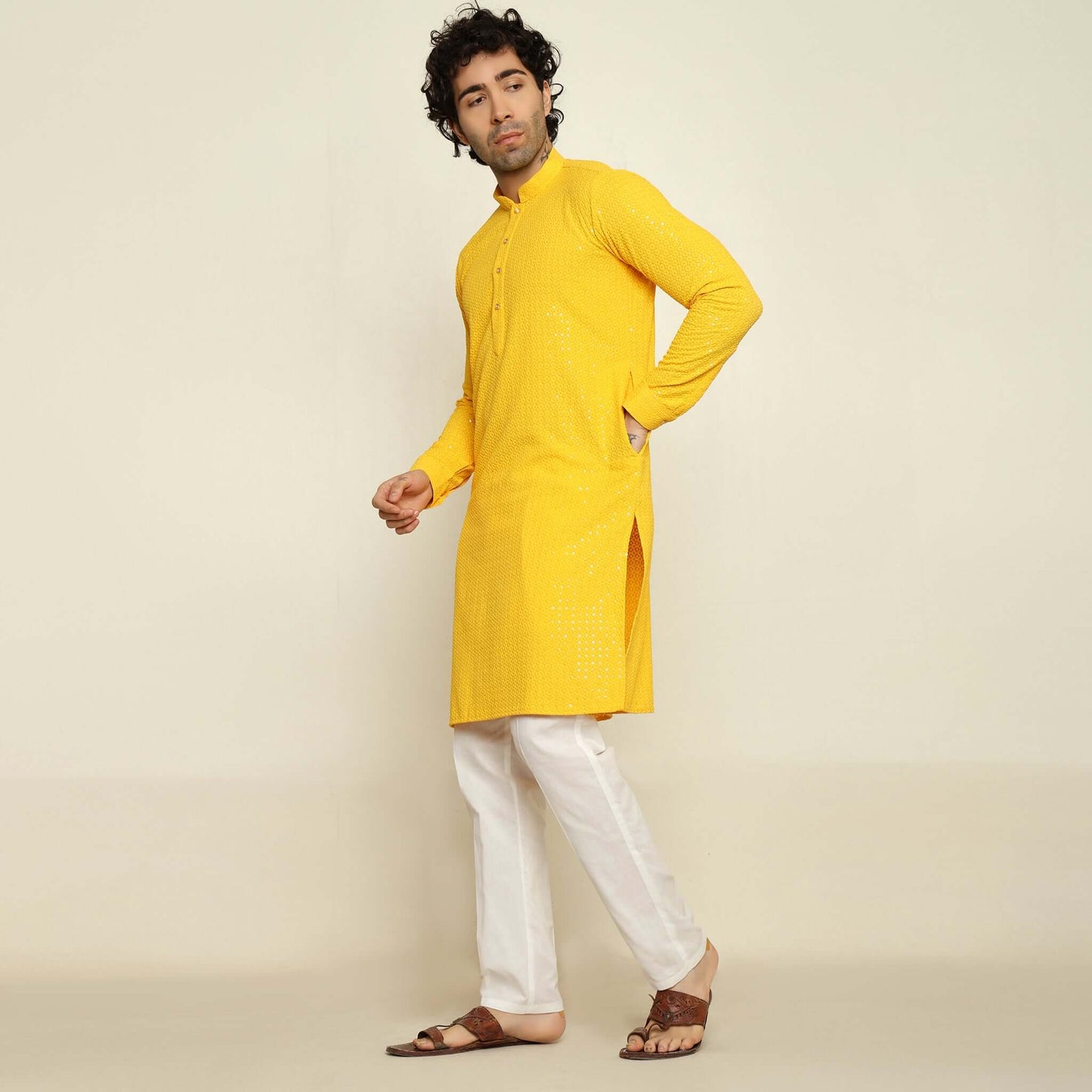 NAQSH Yellow Sequin Embellished Chikankari Kurta for Men which has chikankari and sequins embellishments. Perfect mens haldi wedding kurta for male by Crease India.