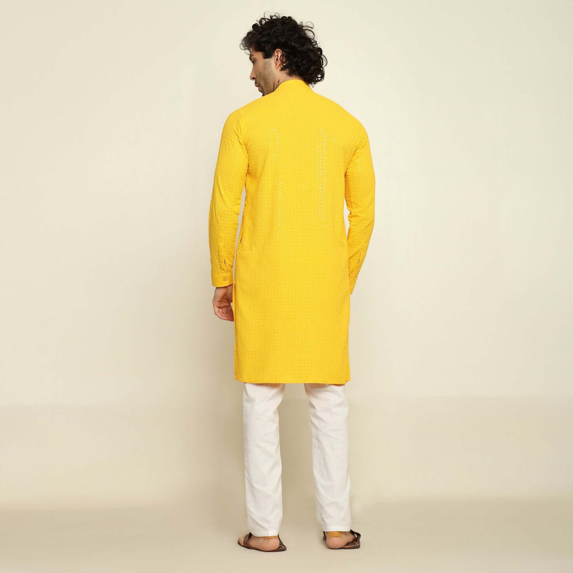 NAQSH Yellow Sequin Embellished Chikankari Kurta for Men which has chikankari and sequins embellishments. Perfect mens haldi wedding kurta for male by Crease India.