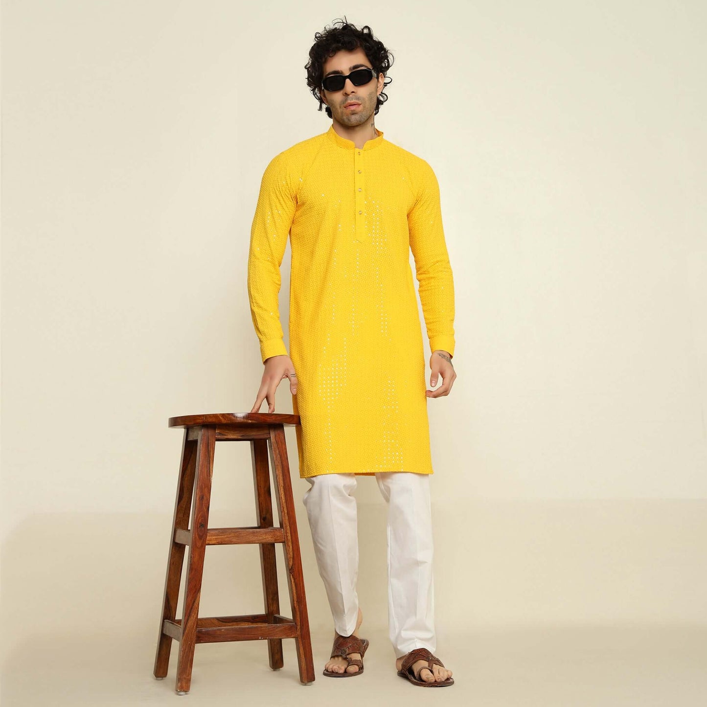 NAQSH Yellow Sequin Embellished Chikankari Kurta for Men which has chikankari and sequins embellishments. Perfect mens haldi wedding kurta for male by Crease India.