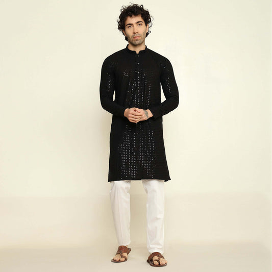 NAQSH Black Sequin Embellished Chikankari Kurta for Men which has chikankari and sequins embellishments. Perfect mens black wedding kurta for male by Crease India.