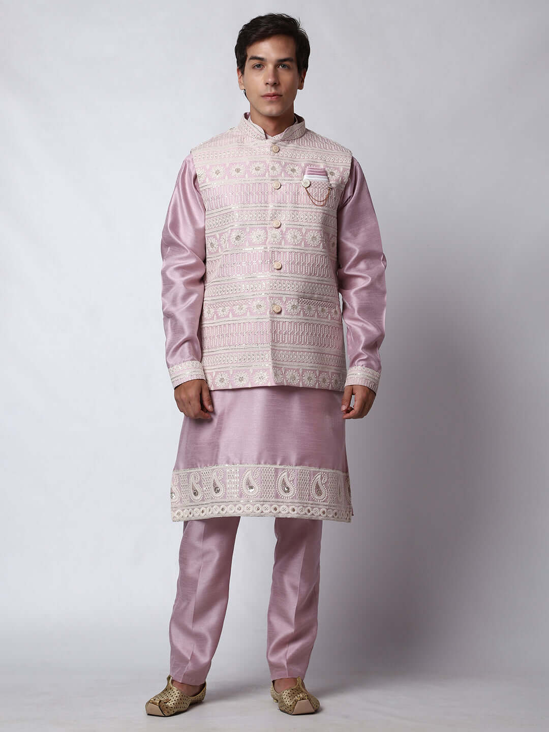  Mauve Kurta Pant with Jacket for men available online in India. A sophisticated men's ethnic wear ensemble featuring a mauve dupion silk kurta jacket set. The net embroidered jacket with sequins adds a touch of elegance, while the kurta and pants provide a comfortable fit. This designer kurta jacket set for men is ideal for weddings, Diwali, Eid, Navratri, & more festivals. Shop this designer kurta set for men on Crease India Website.