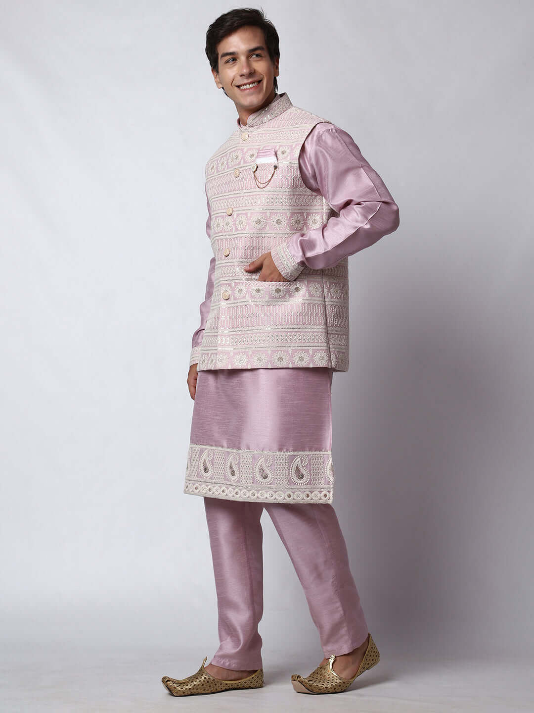  Mauve Kurta Pant with Jacket for men available online in India. A sophisticated men's ethnic wear ensemble featuring a mauve dupion silk kurta jacket set. The net embroidered jacket with sequins adds a touch of elegance, while the kurta and pants provide a comfortable fit. This designer kurta jacket set for men is ideal for weddings, Diwali, Eid, Navratri, & more festivals. Shop this designer kurta set for men on Crease India Website.