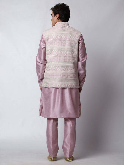  Mauve Kurta Pant with Jacket for men available online in India. A sophisticated men's ethnic wear ensemble featuring a mauve dupion silk kurta jacket set. The net embroidered jacket with sequins adds a touch of elegance, while the kurta and pants provide a comfortable fit. This designer kurta jacket set for men is ideal for weddings, Diwali, Eid, Navratri, & more festivals. Shop this designer kurta set for men on Crease India Website.