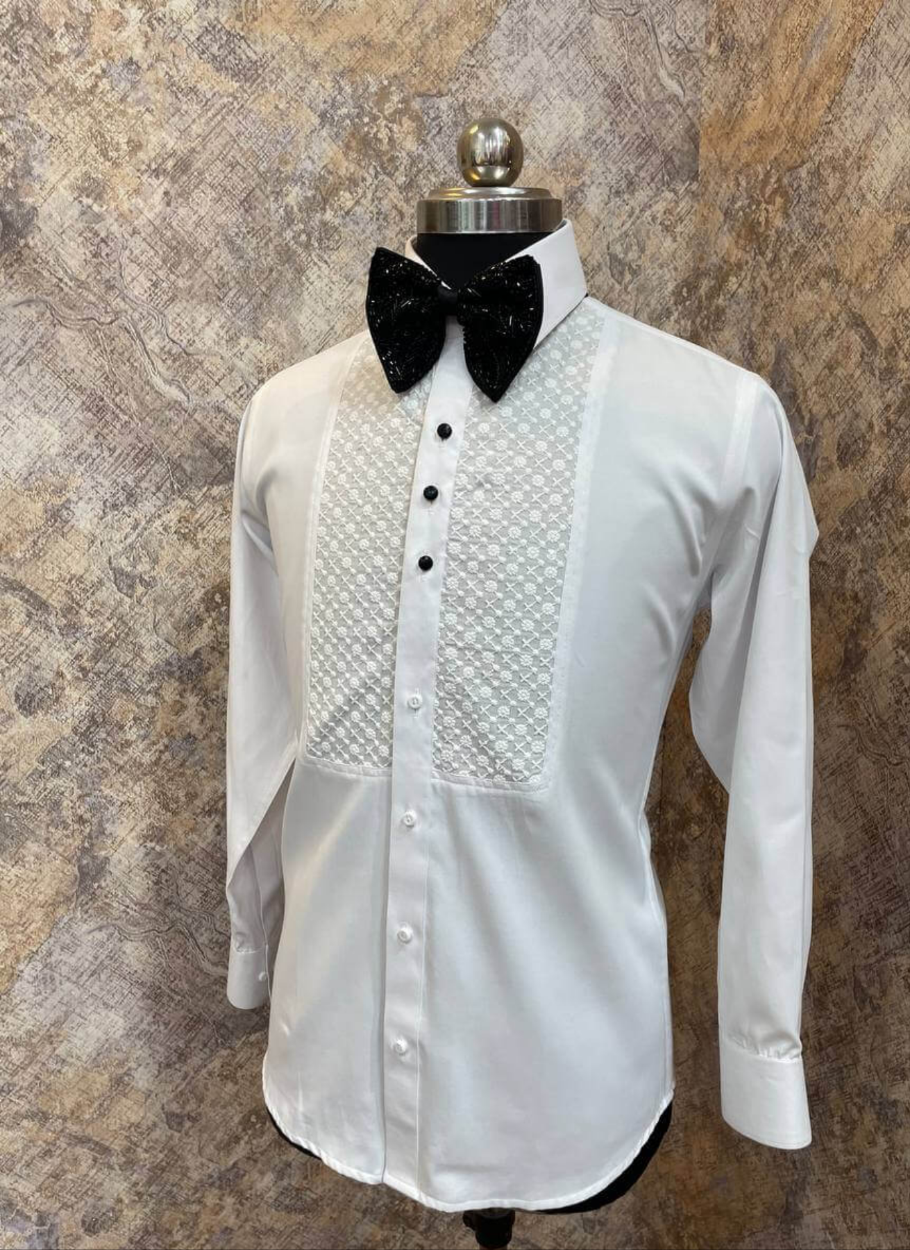 Chikankari Designer White Tuxedo Shirt for Men which is made up of cotton and has chikankari work at the front. Perfect designer formal wear white shirt for weddings and black tie events by Crease India.