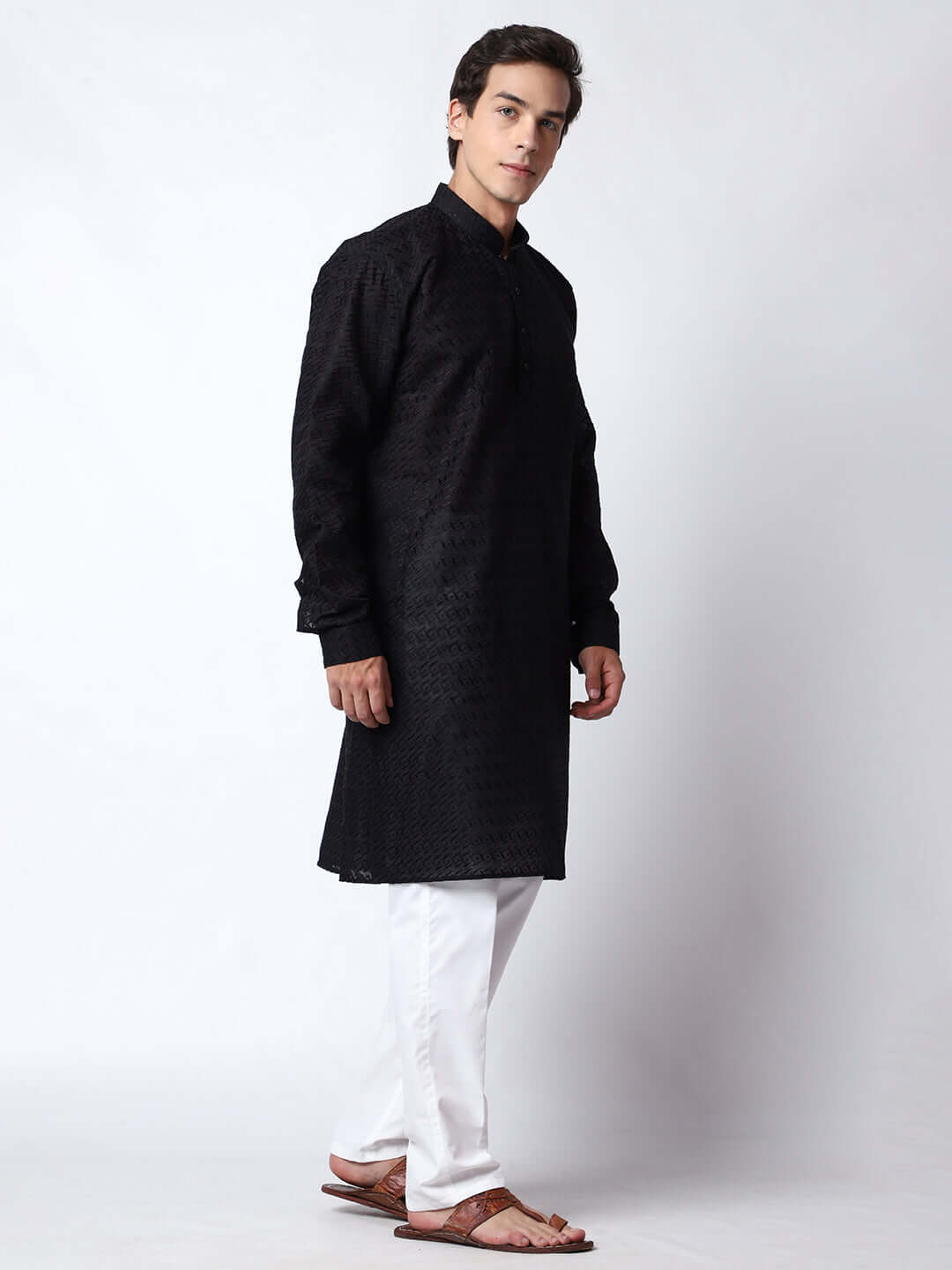 Black Chikankari Kurta for Men, perfect for Indian wedding functions, festivals, casual outings, office ethnic day wear, and other occasions. Shop this chikankari kurta for male on Crease India Website.