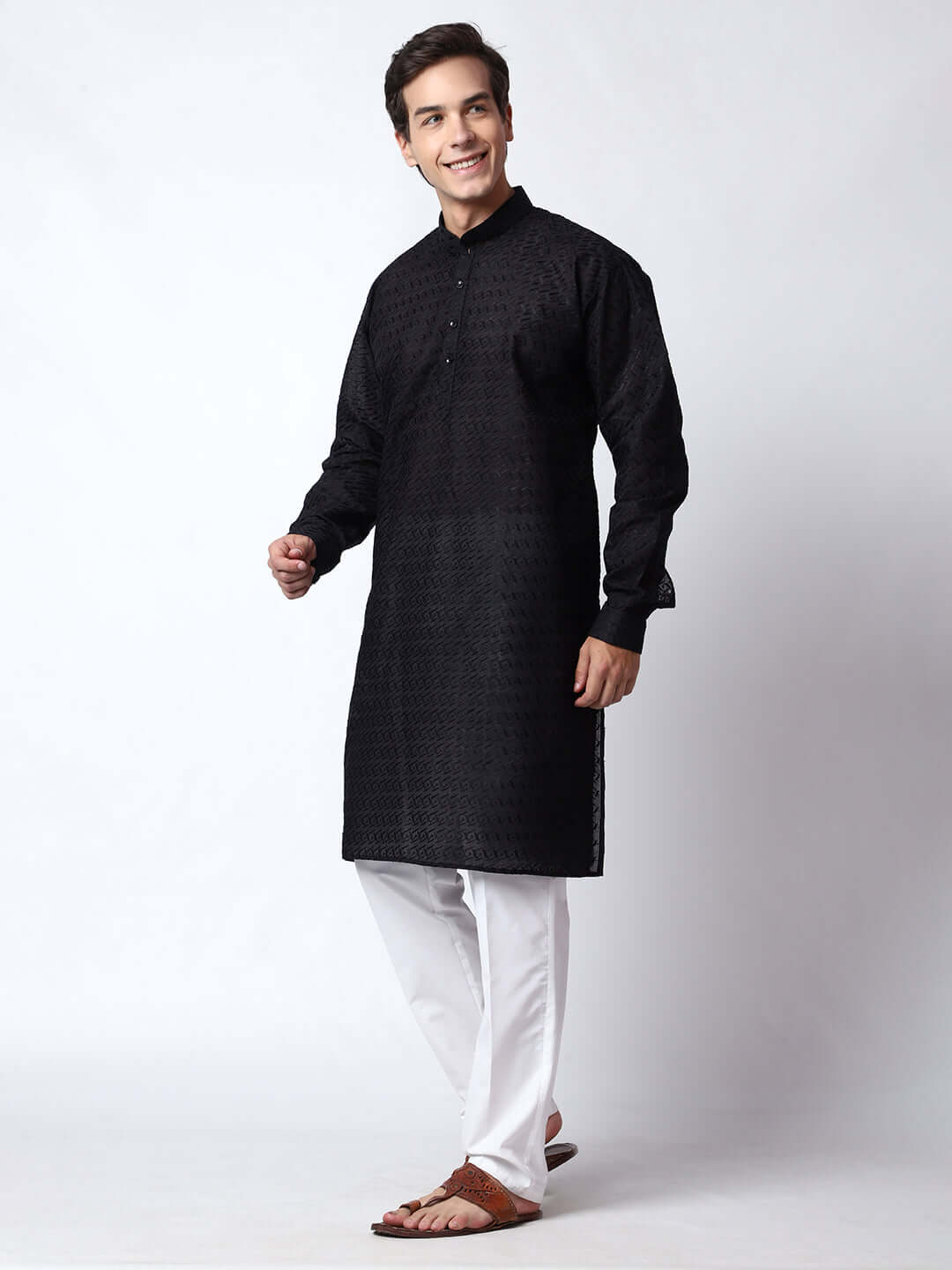 Black Chikankari Kurta for Men, perfect for Indian wedding functions, festivals, casual outings, office ethnic day wear, and other occasions. Shop this chikankari kurta for male on Crease India Website.