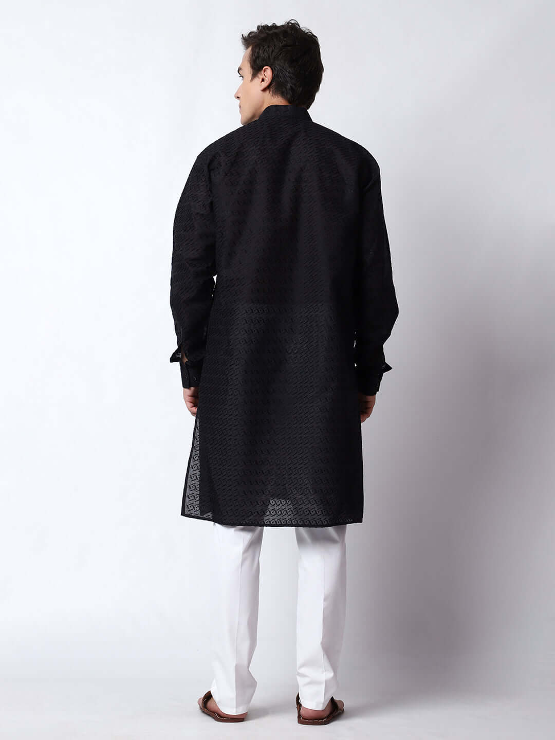 Black Chikankari Kurta for Men, perfect for Indian wedding functions, festivals, casual outings, office ethnic day wear, and other occasions. Shop this chikankari kurta for male on Crease India Website.