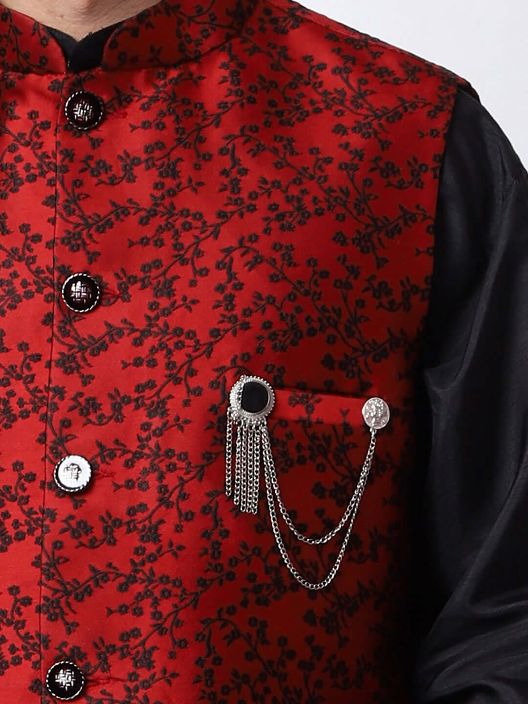 Red & Black kurta jacket set for men available online in India. An elegant men's ethnic wear kurta jacket set with intricate black floral embroidery design on red jacquard jacket. The red jacquard jacket boasts a mandarin collar and complements the black kurta and pants, crafted from smooth cotton silk. This designer red jacquard kurta jacket set for men is ideal for weddings, Diwali, Eid, Navratri, & more festivals. Shop this designer red & black kurta set for men at Crease India Website.