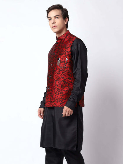 Red & Black kurta jacket set for men available online in India. An elegant men's ethnic wear kurta jacket set with intricate black floral embroidery design on red jacquard jacket. The red jacquard jacket boasts a mandarin collar and complements the black kurta and pants, crafted from smooth cotton silk. This designer red jacquard kurta jacket set for men is ideal for weddings, Diwali, Eid, Navratri, & more festivals. Shop this designer red & black kurta set for men at Crease India Website.