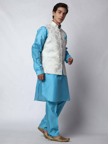 Blue kurta jacket set for men available online in India. An elegant men's ethnic wear kurta jacket set with intricate blue motifs design. The white jacquard jacket boasts a mandarin collar and complements the blue kurta and pants, crafted from smooth dupion silk. This designer blue kurta jacket set for men is ideal for weddings, Diwali, Eid, Navratri, & more festivals. Shop this designer blue kurta set for men at Crease India Website.