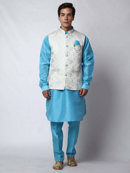 Blue kurta jacket set for men available online in India. An elegant men's ethnic wear kurta jacket set with intricate blue motifs design. The white jacquard jacket boasts a mandarin collar and complements the blue kurta and pants, crafted from smooth dupion silk. This designer blue kurta jacket set for men is ideal for weddings, Diwali, Eid, Navratri, & more festivals. Shop this designer blue kurta set for men at Crease India Website.