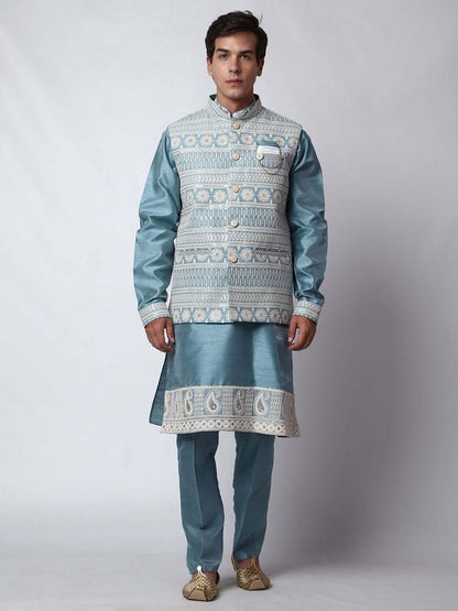 Blue Kurta Pant with Jacket for men available online in India. A sophisticated men's ethnic wear ensemble featuring a blue dupion silk kurta jacket set. The net embroidered jacket with sequins adds a touch of elegance, while the kurta and pants provide a comfortable fit. This designer kurta jacket set for men is ideal for weddings, Diwali, Eid, Navratri, & more festivals. Shop this designer kurta set for men on Crease India Website.