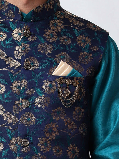 Turquoise Blue kurta jacket set for men available online in India. An elegant men's ethnic wear kurta jacket set with intricate golden floral embroidery. The sophisticated midnight blue jacket boasts a mandarin collar and complements the turquoise blue kurta and pants, crafted from smooth dupion silk. This designer kurta jacket set for men is ideal for weddings, Diwali, Eid, Navratri, & more festivals. Shop this designer kurta set for men on Crease India Website.