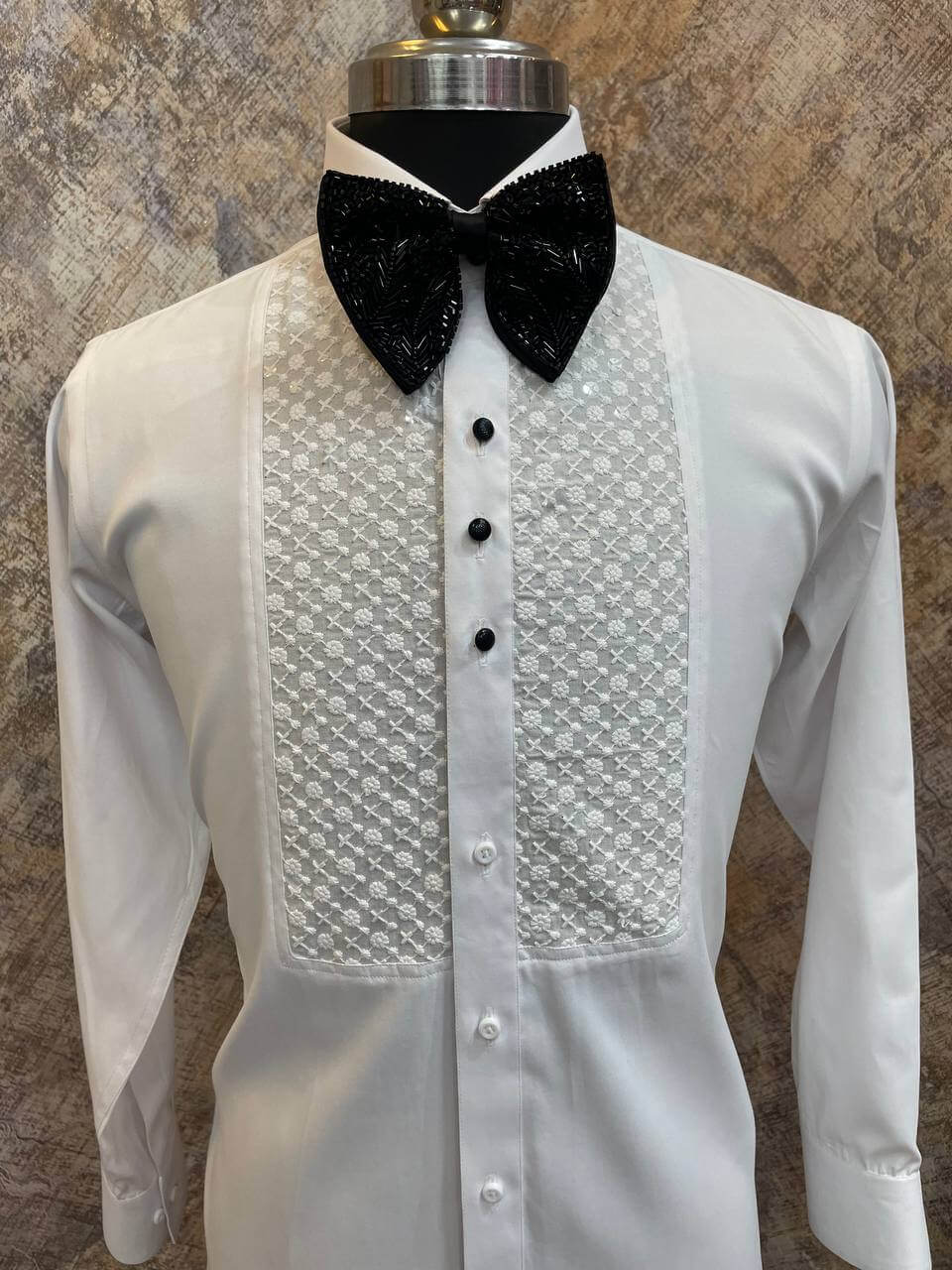 Chikankari Tuxedo Shirt for Men, perfect for weddings. galas, prom nights, black tie events, and other formal events. Shop this designer white tuxedo shirt for men on Crease India Website.