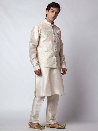 Cream Dupion Silk Kurta Pant Jacket Set for Men. This designer kurta set for men features a luxurious dupion silk jacket adorned with intricate and vibrant multicolored thread embroidery. The matching cream dupion silk kurta and pants complement the embroidered jacket beautifully. This men's kurta set is ideal for weddings, Diwali, Eid, Navratri, & special occasions. Buy this designer kurta jacket set for men at Crease India website.