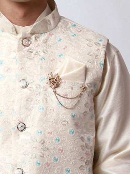 Cream Dupion Silk Kurta Pant Jacket Set for Men. This designer kurta set for men features a luxurious dupion silk jacket adorned with intricate and vibrant multicolored thread embroidery. The matching cream dupion silk kurta and pants complement the embroidered jacket beautifully. This men's kurta set is ideal for weddings, Diwali, Eid, Navratri, & special occasions. Buy this designer kurta jacket set for men at Crease India website.