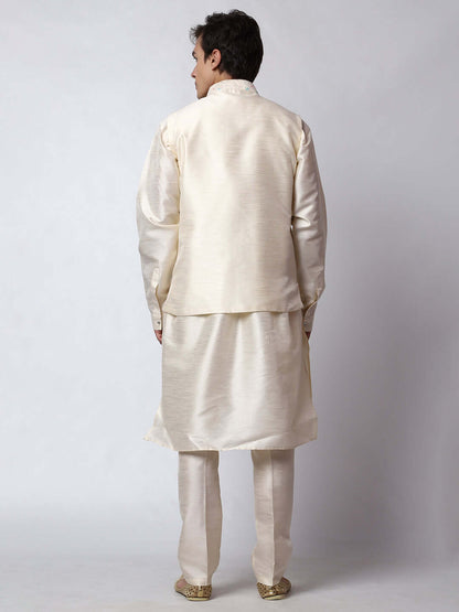 Cream Dupion Silk Kurta Pant Jacket Set for Men. This designer kurta set for men features a luxurious dupion silk jacket adorned with intricate and vibrant multicolored thread embroidery. The matching cream dupion silk kurta and pants complement the embroidered jacket beautifully. This men's kurta set is ideal for weddings, Diwali, Eid, Navratri, & special occasions. Buy this designer kurta jacket set for men at Crease India website.