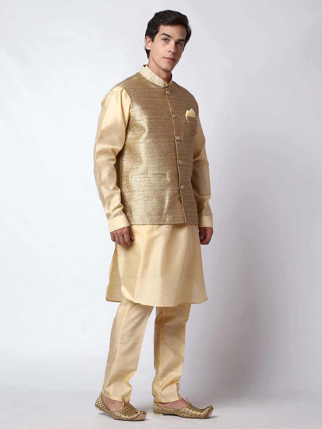 Dark Fawn kurta jacket set for men available online in India. An elegant men's ethnic wear kurta jacket set with intricate golden petal embroidery. The sophisticated dark fawn jacket boasts a mandarin collar and complements the same hue kurta and pants, crafted from smooth dupion silk. This designer kurta jacket set for men is ideal for weddings, Diwali, Eid, Navratri, & more festivals. Shop this designer kurta set for men on Crease India Website.