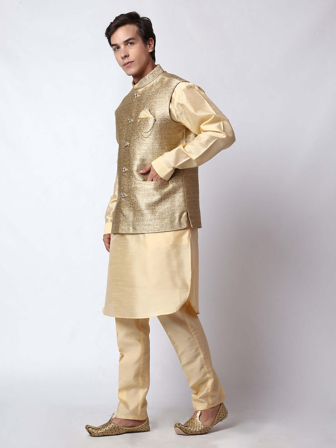 Dark Fawn kurta jacket set for men available online in India. An elegant men's ethnic wear kurta jacket set with intricate golden petal embroidery. The sophisticated dark fawn jacket boasts a mandarin collar and complements the same hue kurta and pants, crafted from smooth dupion silk. This designer kurta jacket set for men is ideal for weddings, Diwali, Eid, Navratri, & more festivals. Shop this designer kurta set for men on Crease India Website.