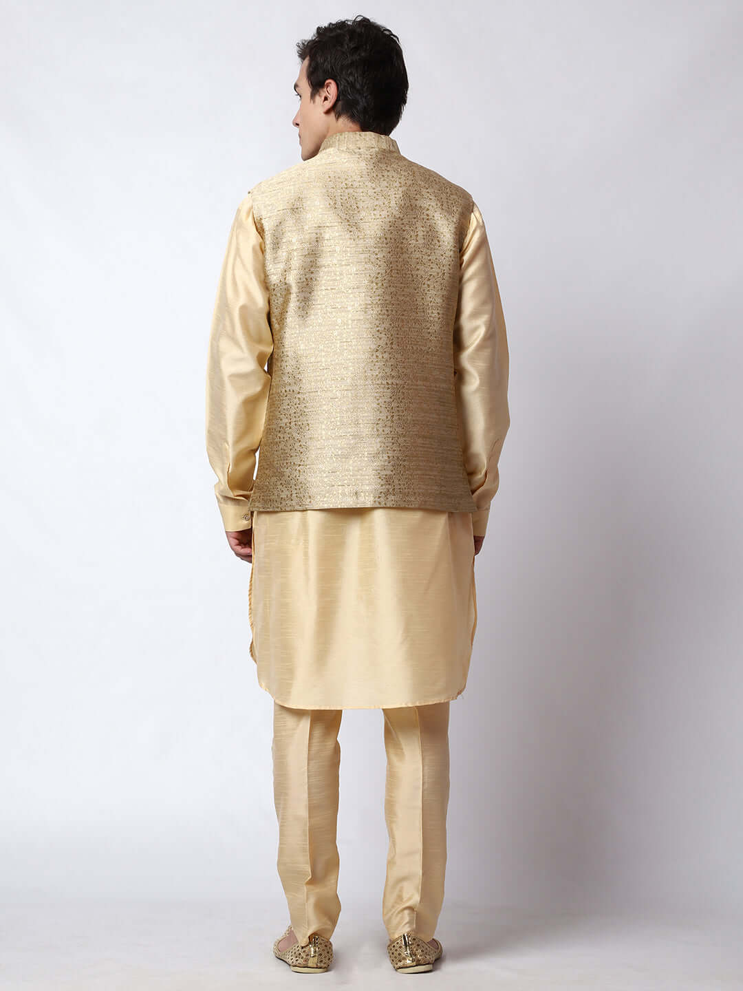 Dark Fawn kurta jacket set for men available online in India. An elegant men's ethnic wear kurta jacket set with intricate golden petal embroidery. The sophisticated dark fawn jacket boasts a mandarin collar and complements the same hue kurta and pants, crafted from smooth dupion silk. This designer kurta jacket set for men is ideal for weddings, Diwali, Eid, Navratri, & more festivals. Shop this designer kurta set for men on Crease India Website.