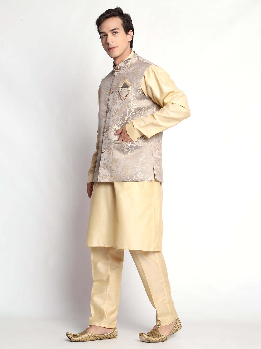 Fawn kurta jacket set for men available online in India. An elegant men's ethnic wear kurta jacket set with intricate fawn floral embroidery design on grey satin jacquard jacket. The grey satin jacquard jacket boasts a mandarin collar and complements the fawn kurta and pants, crafted from smooth cotton silk. This designer fawn satin jacquard kurta jacket set for men is ideal for weddings, Diwali, Eid, Navratri, & more festivals. Shop this designer fawn kurta set for men at Crease India Website