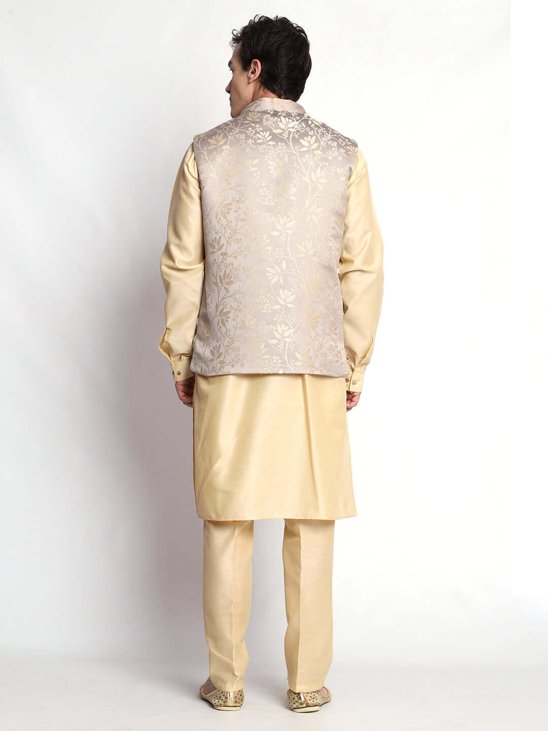 Fawn kurta jacket set for men available online in India. An elegant men's ethnic wear kurta jacket set with intricate fawn floral embroidery design on grey satin jacquard jacket. The grey satin jacquard jacket boasts a mandarin collar and complements the fawn kurta and pants, crafted from smooth cotton silk. This designer fawn satin jacquard kurta jacket set for men is ideal for weddings, Diwali, Eid, Navratri, & more festivals. Shop this designer fawn kurta set for men at Crease India Website