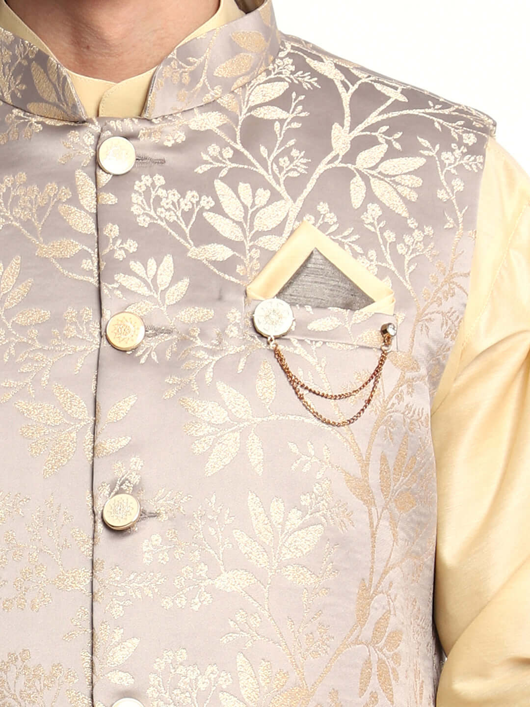 Fawn kurta jacket set for men available online in India. An elegant men's ethnic wear kurta jacket set with intricate fawn floral embroidery design on grey satin jacquard jacket. The grey satin jacquard jacket boasts a mandarin collar and complements the fawn kurta and pants, crafted from smooth cotton silk. This designer fawn satin jacquard kurta jacket set for men is ideal for weddings, Diwali, Eid, Navratri, & more festivals. Shop this designer fawn kurta set for men at Crease India Website