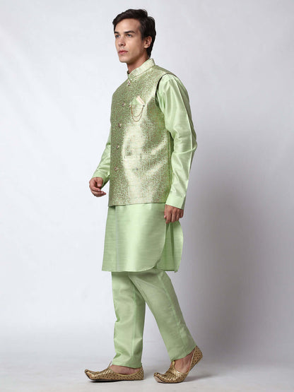 Lush Green kurta jacket set for men available online in India. An elegant men's ethnic wear kurta jacket set with intricate golden petal embroidery. The embroidered jacket boasts a mandarin collar and complements the same hue kurta and pants, crafted from smooth dupion silk. This lush green designer kurta jacket set for men is ideal for weddings, Diwali, Eid, Navratri, & more festivals. Shop this lush green designer kurta set for men on Crease India Website.