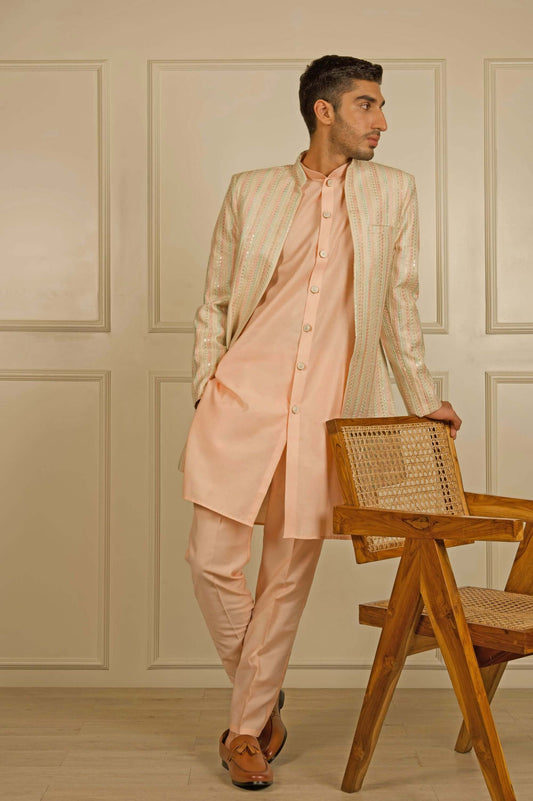 Peach Indo Western dress for men which is made up mulberry silk and have heavy embroidery on it. Shop this mens indo western dress for male from Crease India website.