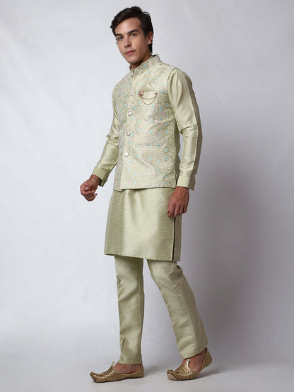 Pista Green Dupion Silk Kurta Pant Jacket Set for Men. This designer kurta set for men features a luxurious dupion silk jacket adorned with intricate and vibrant multicolored thread embroidery. The matching pista green dupion silk kurta and pants complement the embroidered jacket beautifully. This men's kurta set is ideal for weddings, Diwali, Eid, Navratri, & special occasions. Buy this designer kurta jacket set for men at Crease India website.