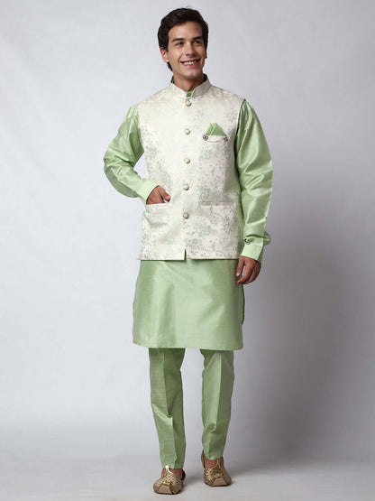 Pista Green kurta jacket set for men available online in India. An elegant men's ethnic wear kurta jacket set with intricate floral embroidery on white jacquard jacket. The white jacquard jacket boasts a mandarin collar and complements the pista green kurta and pants, crafted from smooth dupion silk. This pista green designer kurta jacket set for men is ideal for weddings, Diwali, Eid, Navratri, & more festivals. Shop this pista green designer kurta set for men on Crease India Website.