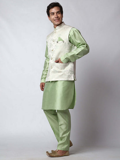 Pista Green kurta jacket set for men available online in India. An elegant men's ethnic wear kurta jacket set with intricate floral embroidery on white jacquard jacket. The white jacquard jacket boasts a mandarin collar and complements the pista green kurta and pants, crafted from smooth dupion silk. This pista green designer kurta jacket set for men is ideal for weddings, Diwali, Eid, Navratri, & more festivals. Shop this pista green designer kurta set for men on Crease India Website.