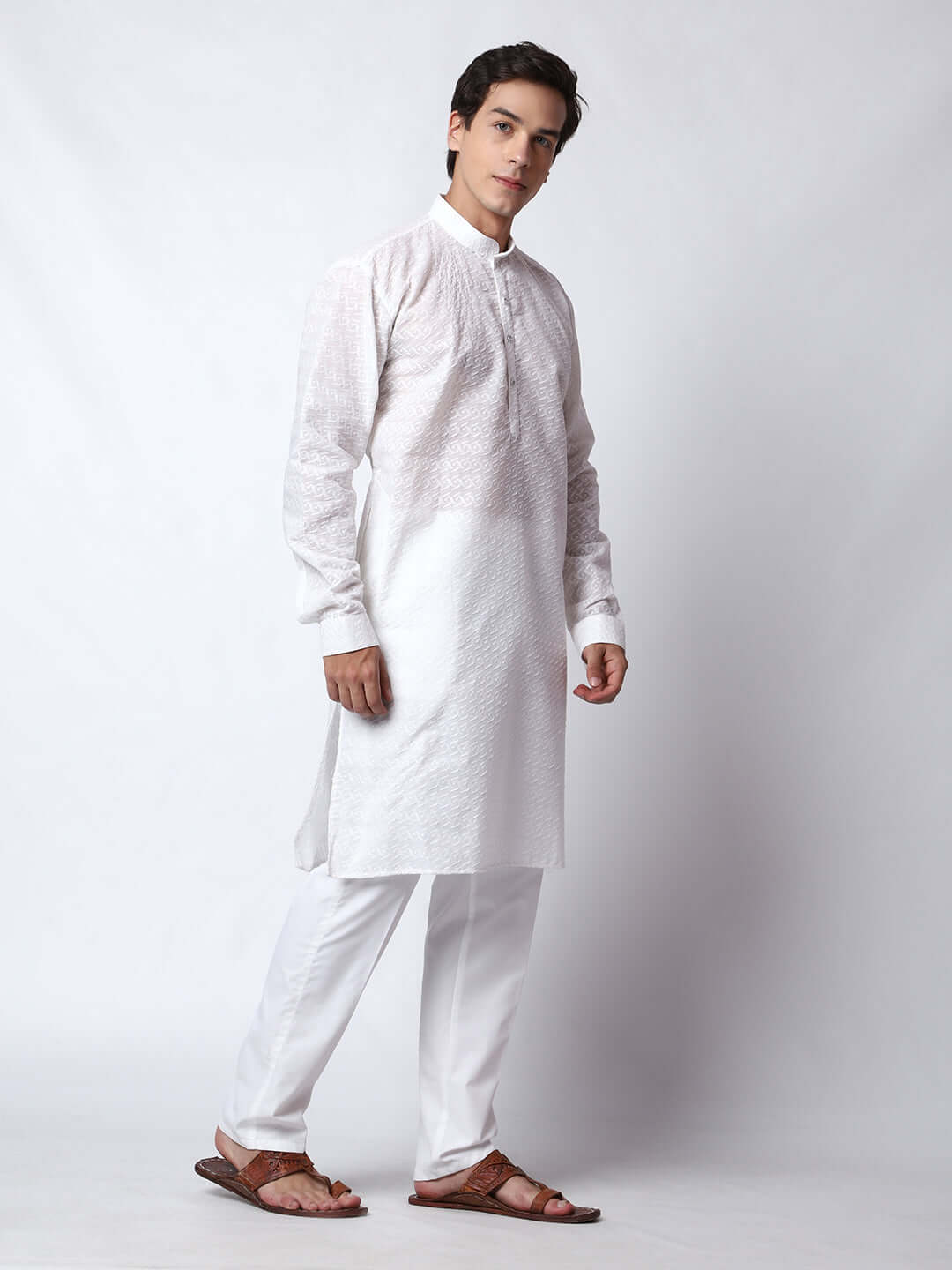 White Chikankari Kurta for Men, perfect for Indian wedding functions, festivals, casual outings, office ethnic day wear, and other occasions. Shop this chikankari kurta for male on Crease India Website.